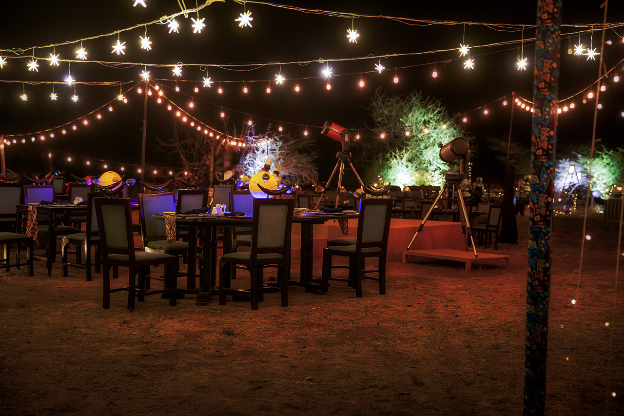 Outdoor dining and stargazing telescopes at Samburu Sopa Lodge